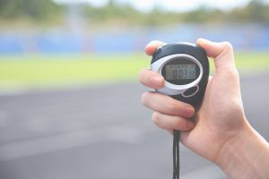 Hand holding an electronic stopwatch