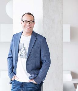 Male Marketing Consultant Standing Smiling