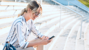 Woman reading a marketing article on a phone